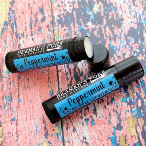 Peppermint lip balm on a rustic wood colorful surface