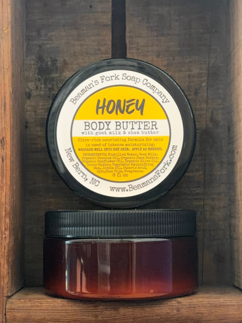 Jar of Honey Scented Goat Milk Body Butter on a rustic wood table
