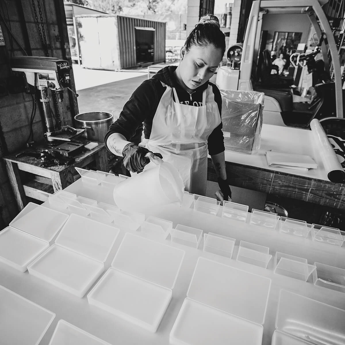 Pouring Wend wax bars into containers in the Vista, California factory