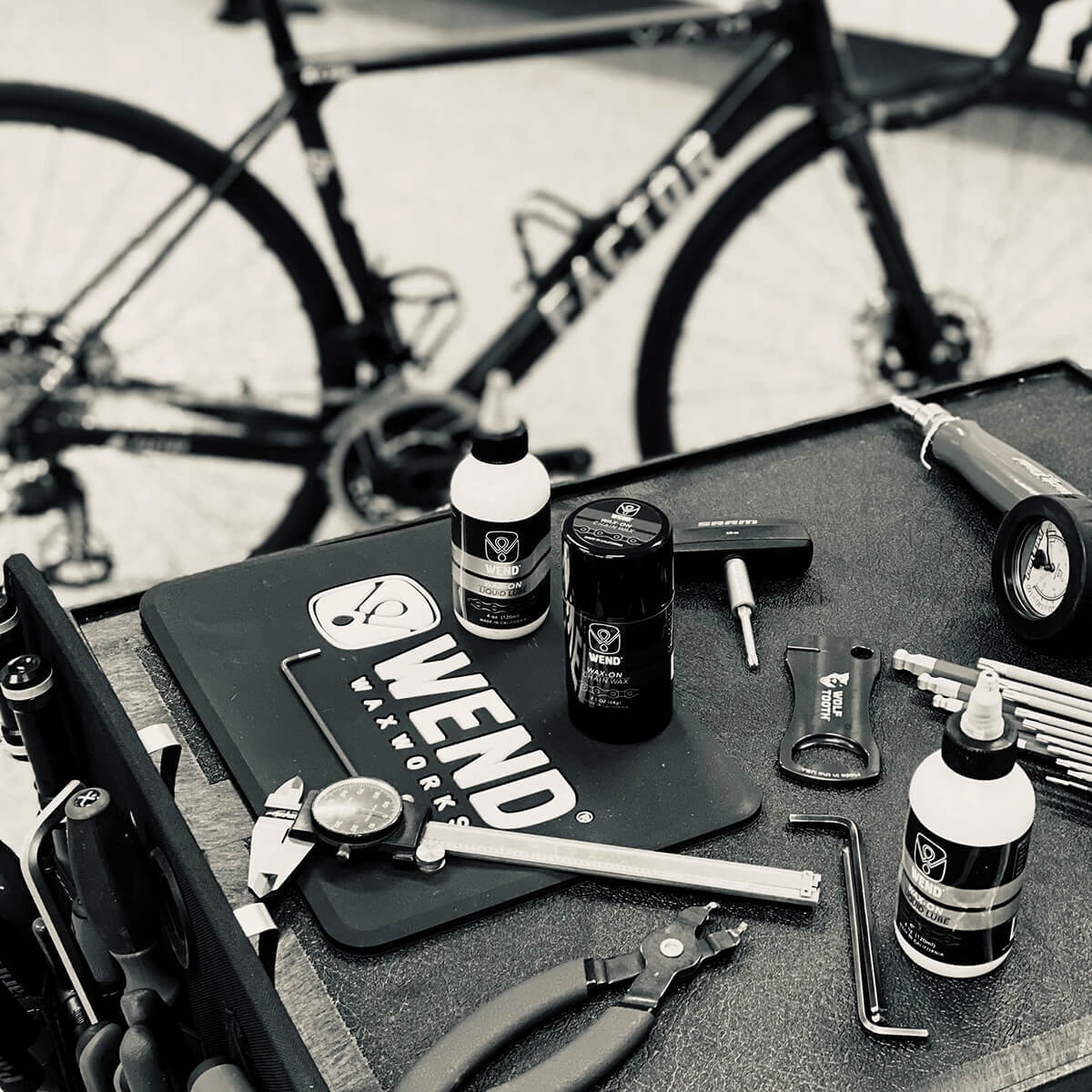 Wend Bike products on a bike shop counter with bike tuning tools.