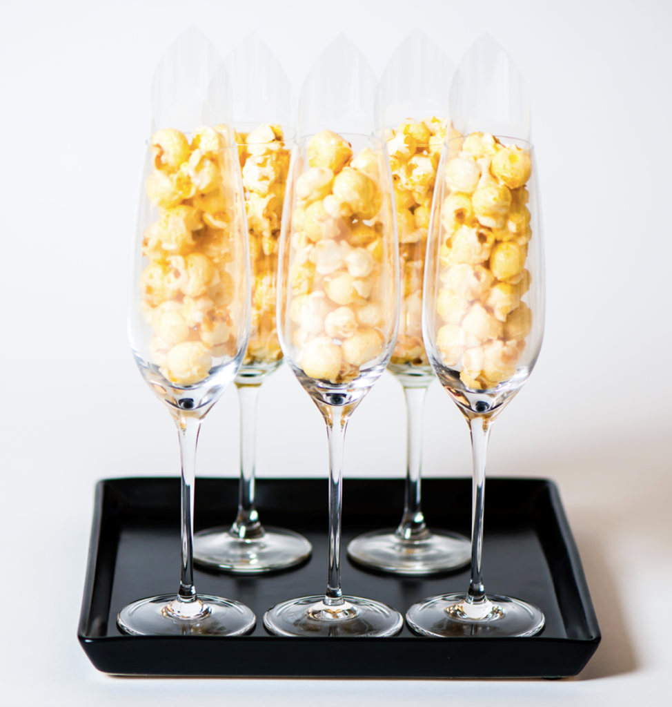 Create a memorable snacking experience with our CUSTOMIZED DIY HotPoppin Gourmet Popcorn Bar. This unique package includes 1 glass jar filled with our delicious gourmet popcorn, allowing you to customize your own popcorn creations. Whether you're hosting a party, wedding, or special event, this popcorn bar will be a hit among your guests. With 35 servings, everyone can enjoy their favorite flavors and toppings. Personalize the popcorn with your own selection of seasonings, drizzles, and mix-ins for a truly customized treat. Elevate your event and make it pop with our CUSTOMIZED DIY HotPoppin Gourmet Popcorn Bar.