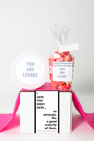 The Love You Gift is a heartfelt expression of affection that combines two sweet treats to show someone special just how much they mean to you. This charming gift includes a delightful assortment of two sweet treats that will warm their heart and satisfy their sweet tooth. With the playful message "LOVE YOU MOST DAYS" adorning the packaging, this gift is perfect for anniversaries, birthdays, or any occasion that calls for a little extra love. Each treat is carefully crafted with love and attention to detail, ensuring a delicious and memorable experience. Show your love in the sweetest way possible with the Love You Gift.