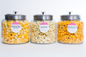 Get ready to create a popcorn experience like no other with the DIY HotPoppin Gourmet Popcorn Bar. This unique set includes three glass jars filled with our delicious gourmet popcorn, allowing you to customize your snacking adventure. Each jar is filled with a variety of flavors, from classic butter to zesty jalapeno and sweet caramel. With 100 servings in total, you can delight your guests at parties, events, or even create your own popcorn bar at home. Let your creativity shine as you mix and match flavors, and watch everyone enjoy the magic of HotPoppin Gourmet Popcorn. Elevate your gatherings and bring a memorable popcorn experience to life with the DIY HotPoppin Gourmet Popcorn Bar.