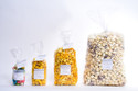 Bring the ultimate snacking experience to your event with the DIY HotPoppin Gourmet Popcorn Bar Refills. Designed to accompany our DIY Popcorn Bar, these refill packs ensure that the popcorn party never ends. Each refill pack includes three tantalizing flavors, allowing you to customize and create a popcorn extravaganza that will delight up to 100 guests. Choose from a variety of mouthwatering options, including Classic Butter, Zesty Jalapeno, Sweet Caramel, and more. Elevate your event and let your guests indulge in the irresistible flavors of HotPoppin Gourmet Popcorn. Whether it's a wedding, birthday party, or corporate event, the DIY HotPoppin Gourmet Popcorn Bar Refills will leave everyone craving for more.