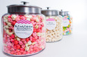 Create a popcorn extravaganza with the DIY HotPoppin Gourmet Popcorn Bar. This set includes 5 glass jars filled with our delectable gourmet popcorn, providing you with 200 servings of pure popcorn bliss. Bring the fun and excitement to any gathering as guests can customize their popcorn experience with a variety of flavors and toppings. From classic butter and zesty cheddar to sweet caramel and spicy jalapeno, the possibilities are endless. Whether it's a birthday party, wedding reception, or corporate event, the DIY HotPoppin Gourmet Popcorn Bar is sure to be a hit. Unleash your creativity and treat your guests to a memorable snacking experience with this popcorn bar extravaganza.