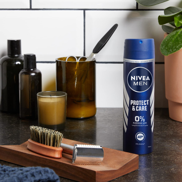 NIVEA Dry 48H Protect Care deodorant spray 150ml can placed on bathroom shelf NIVEA Dry 48H Protect Care deodorant spray 150ml can placed on bathroom shelf
