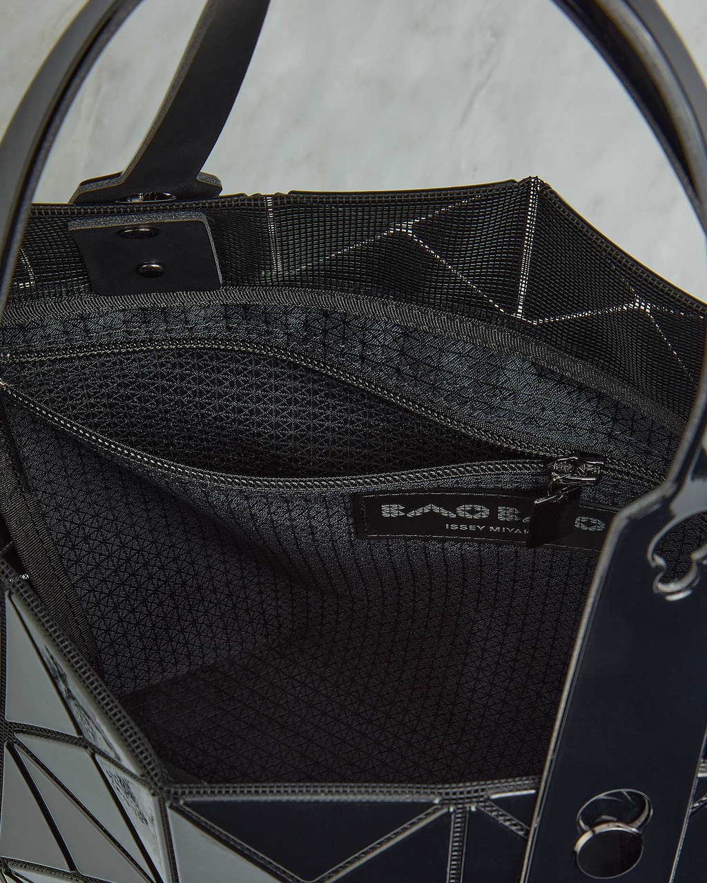 Interior zip pocket of Bao Bao Issey Miyake tote bag for secure storage of small items. View Product Image