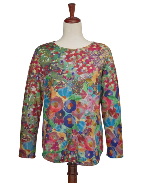 Potpourri print top displayed on a mannequin, highlighting its modern silhouette.