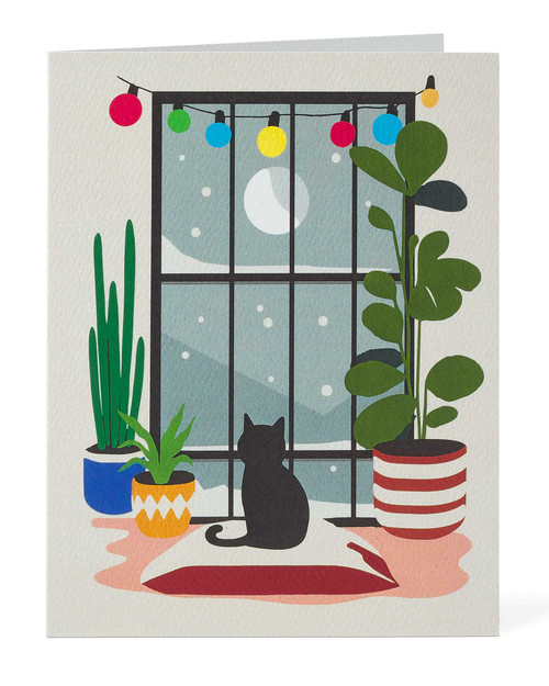 "Update Alt text from: Cat Watching the Snow Holiday Cards View Product Image
To: Cute cat Christmas cards featuring a black feline gazing at snow outside a glowing window."