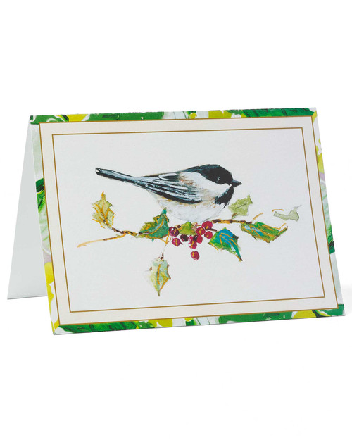 Illustrated chickadee Christmas card featuring a bird perched on holly with subtle holiday accents.