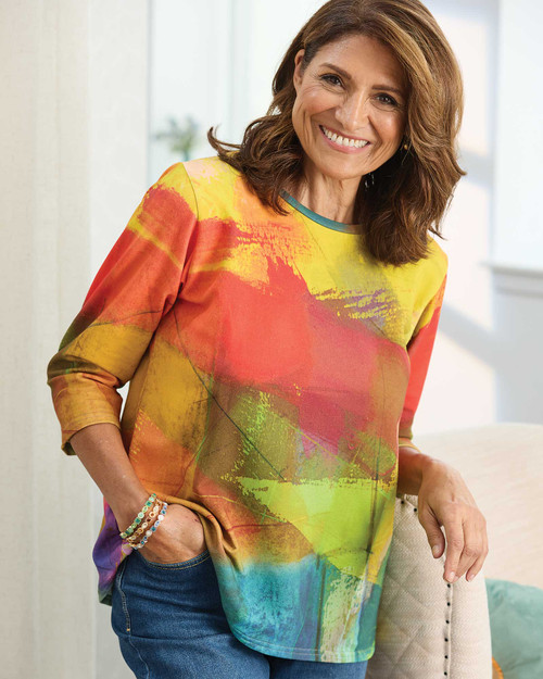 Woman models bold modern art blouse by Andrea Geer, a unique pick for organic cotton gifts. View Product Image