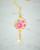Close detail of a drop earring with gold-tone accents, part of our pink floral Japanese jewelry set. View Product Image