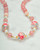 A necklace from a pink floral Japanese tensha beads jewelry set. View Product Image