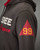 Tuskegee jacket side view emphasizing the bold number 99 graphic. View Product Image