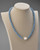 Angelite jewelry shown on a mannequin highlighting soft blue stones. View Product Image