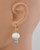 Blue angelite earrings displayed on a mannequin to show length and fit. View Product Image