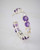 Close-up highlights gemstones used in amethyst earrings hoop with sterling silver. View Product Image