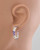 Amethyst earrings hoop displayed on a mannequin to show scale and fit. View Product Image