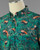 The folded collar and top buttons of the red panda button down shirt, showcasing the fabric. View Product Image