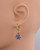 Profile view of a mannequin wearing the halo drop earrings to show the length and how they hang from the ear. View Product Image