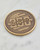 Front view of the detailed antiqued bronze America 250 coin with crisp reliefs, exclusive America 250 merch. View Product Image