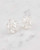 Close-up detail of the faceted stones and sterling silver setting on beautiful white topaz earrings. View Product Image