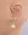 Side view of the white topaz baguette earrings highlighting the secure hinged leverback clasp. View Product Image