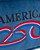Detailed view of the embroidered red, white, and blue commemorative logo on patriotic America 250 merchandise. View Product Image