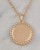 Gold pave crystal necklace with beaded edge on marble background. View Product Image