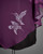Close-up of hummingbird design on purple chiffon top, featuring bold lines and cultural symbolism. View Product Image