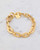 Gold etched chain bracelet with with textured links in 22k gold-plated finish by Lingua Nigra. View Product Image