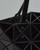 Adjustable handles on Bao Bao Issey Miyake tote shown for versatile carrying. View Product Image