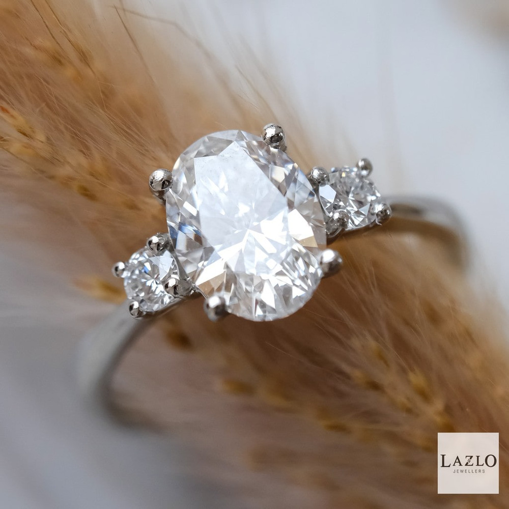 Platinum Laboratory 1.83ct D VVS2 Oval & Two 0.22ct Round Brilliant Diamond Engagement Ring 1