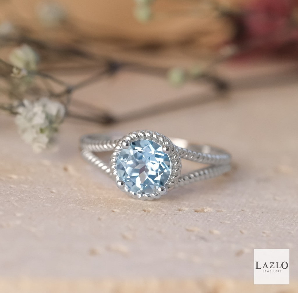 9kt White Gold Aquamarine Rope Style Surround Dress Ring