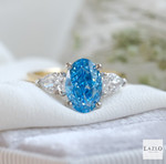 18kt Yellow Gold Platinum Oval 2.08ct Laboratory Blue Diamond & Two Side Laboratory 0.72ct Pear Diamond Ring 1