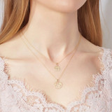 9kt yellow gold around the world necklace on model