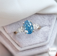 18kt Yellow Gold Platinum Oval 2.08ct Laboratory Blue Diamond & Two Side Laboratory 0.72ct Pear Diamond Ring 2