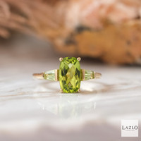 9kt Yellow Gold Three Stone Long Cushion Peridot & Taper Side Stone Ring 1 9kt Yellow Gold Three Stone Long Cushion Peridot & Taper Side Stone Ring 1