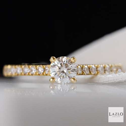 18kt Yellow Gold 0.30ct Round Brilliant Solitaire Castille Set Diamond Shoulders 1 18kt Yellow Gold 0.30ct Round Brilliant Solitaire Castille Set Diamond Shoulders 1