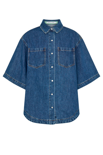 A cool classic, this oversized denim shirt channels effortless casual with a soft curve hem, chest patch pockets, and short sleeves. Made from premium cotton denim with just the right weight, it’s a wardrobe essential that pairs beautifully with everything from shorts to tailored pants.