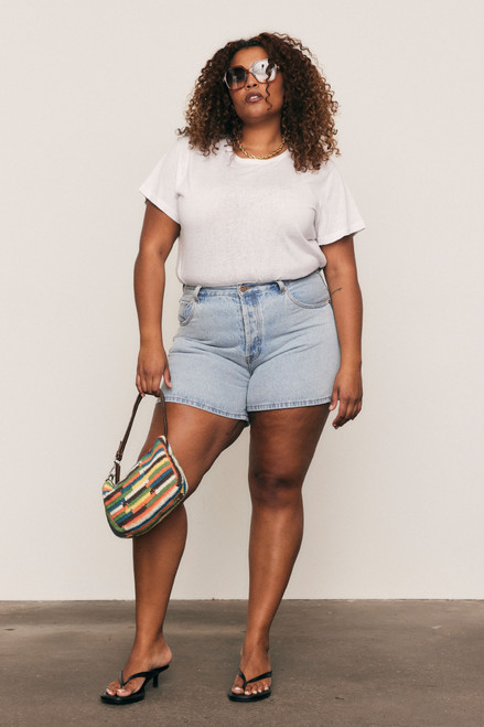 Fresh, fun, and handmade - this cotton crochet mini bag with leather accents brings artisanal charm and effortless style to your everyday wardrobe.