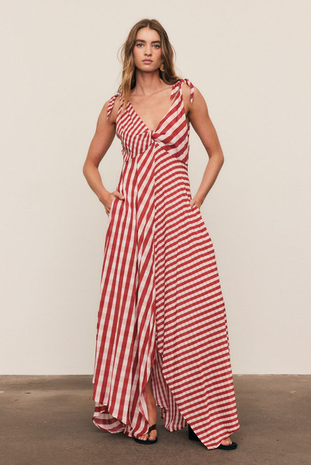 A statement of fluid artistry, the Gingham Scarf Dress is crafted from luxurious soft modal in a custom scarf-print gingham. Its twisted bust, adjustable ties, and sweeping hanky hem create movement and grace. Light as air and endlessly elegant, it’s a festive-season favourite made for weddings, New Year’s soirées, and sunset celebrations.