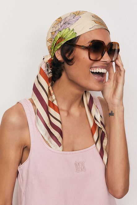 An ode to timeless elegance, the Classic Floral Scarf is crafted from 100% pure silk twill and framed by Bohemian Traders’ exclusive floral placement print. Luxurious and versatile, it can be styled around the neck, tied to a bag handle, or worn as a headscarf. A refined touch of artistry to elevate every look.