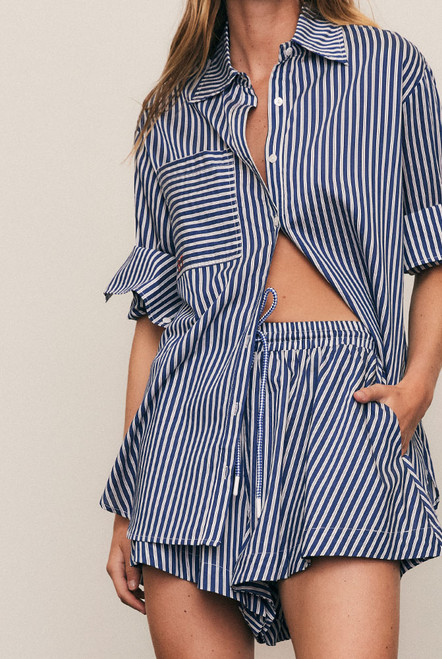 Relaxed and refined, the Stripe Wide Leg Short is crafted from a soft Rayon–Tencel shirting blend in a crisp stripe. Designed with an elasticated waist and fluid wide-leg silhouette, it moves beautifully for effortless summer ease. Pair with the matching Stripe Classic Shirt for a modern, co-ordinated take on everyday dressing.