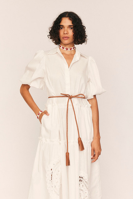 Add a touch of artisanal polish to any look with the Plaited Leather Belt. Hand-braided from 100% leather in a timeless tan hue, this versatile accessory features soft tasselled ends for an elevated bohemian finish.