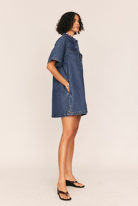 Relaxed yet refined, the Swing Denim Mini Dress is your everyday uniform—reimagined in heavyweight premium cotton denim. Its A-line, boxy silhouette offers an intentionally oversized fit, balanced by sharp details like a classic collar, dropped shoulders, and short sleeves.