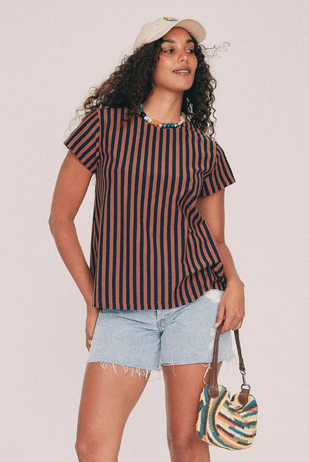 Cut from yarn dyed cotton stripe jersey, this striped tee has a relaxed swing silhouette with cap sleeves. Machine washable and quietly indispensable: wear it with the denim short all summer. Designed from a 6 to a 22.