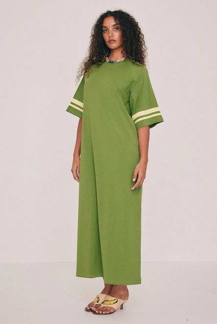Cut from soft cotton jersey, this olive t-shirt maxi dress is the piece you'll reach for first this summer, finished with contrast ringer binding at the neck and sleeves. A side split lends movement. Machine washable and entirely undemanding: trainers now, flat sandals come January - a rainbow crochet bag all the time. Designed from a 6 to a 22.