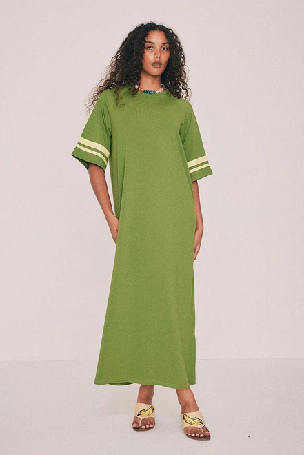 Cut from soft cotton jersey, this olive t-shirt maxi dress is the piece you'll reach for first this summer, finished with contrast ringer binding at the neck and sleeves. A side split lends movement. Machine washable and entirely undemanding: trainers now, flat sandals come January - a rainbow crochet bag all the time. Designed from a 6 to a 22.
