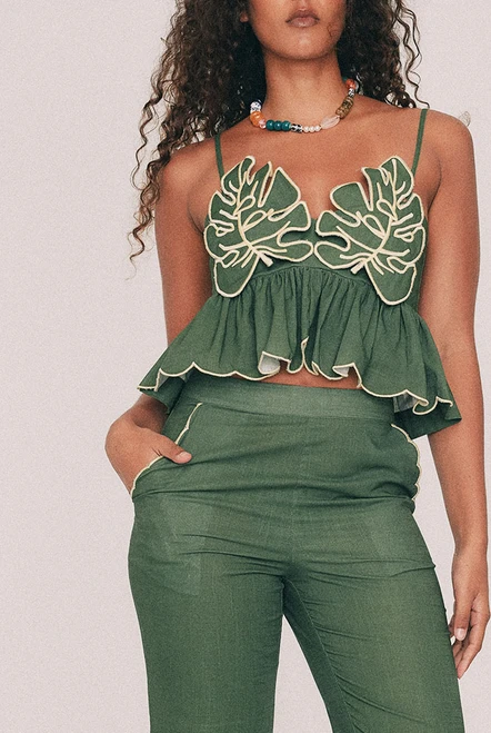 Cut from textured cotton slub, this olive crop top is finished with embroidered leaf detailing to the bust and a scalloped hem, drawn by hand in our Central Coast studio. A concealed zip sits at the centre back. For summer weddings, wear it with the Fern crop flare pant, or keep it casual with denim shorts and very little else. True to size, designed from a 6 to a 22.